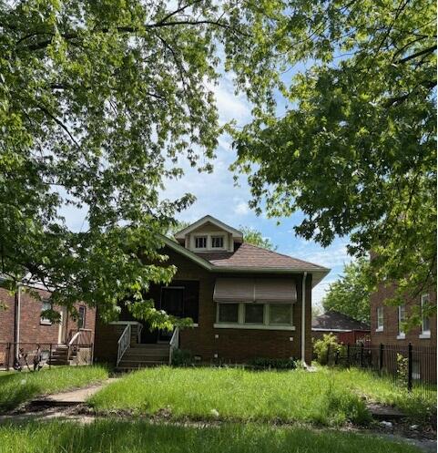 1417 Delaware Street Gary, IN 46407 - Photo 2 of 2 a front view of a house with garden