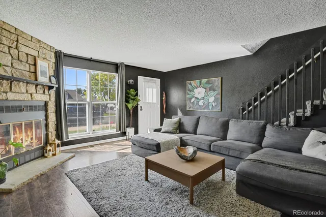 a living room with furniture and a rug