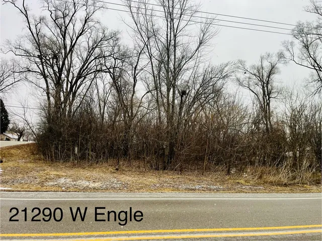 a view of a door and snow on the road