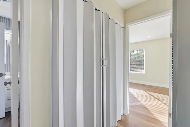 a view of a bathroom from a hallway
