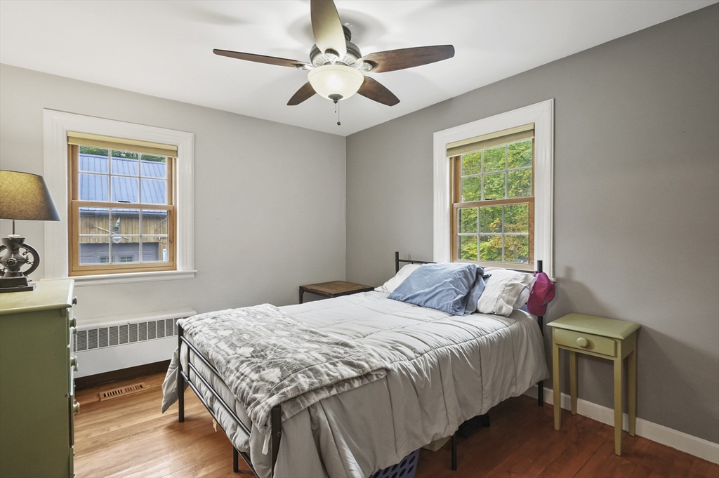 8 Beach Road Shrewsbury, MA 01545 - Photo 14 of 40 a bedroom with a bed and a window