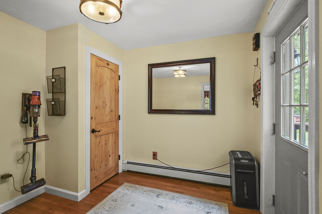 8 Beach Road Shrewsbury, MA 01545 - Photo 16 of 40 a view of a livingroom with wooden floor and a window