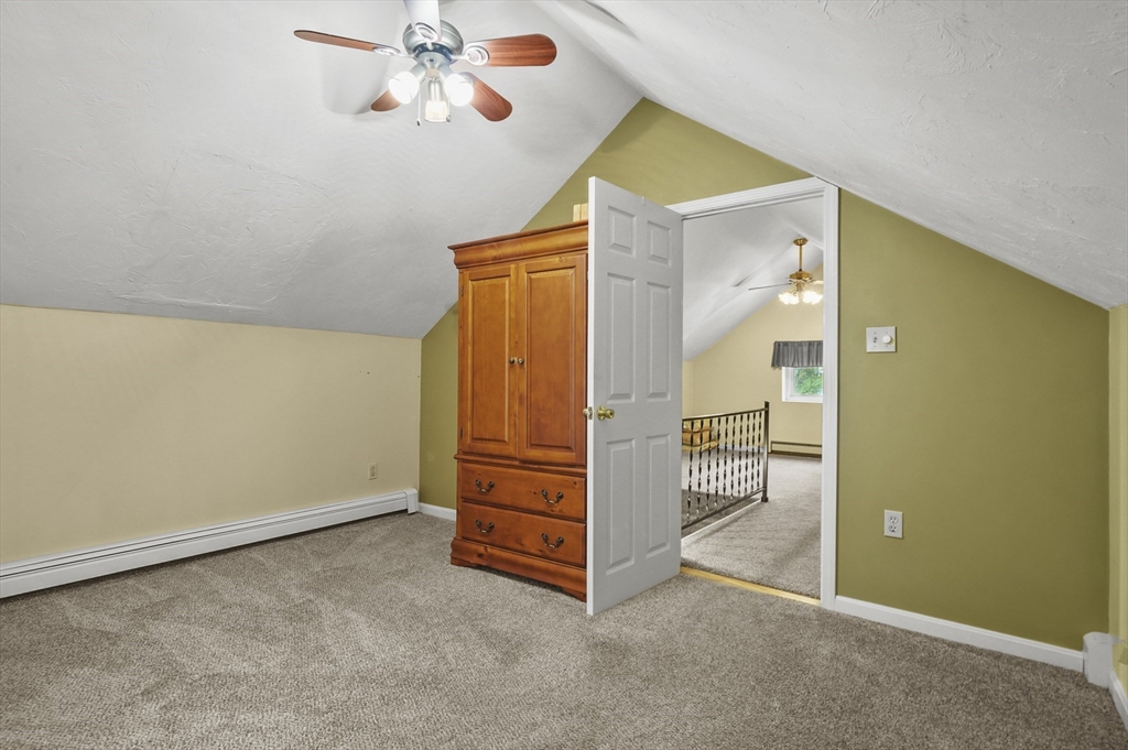 8 Beach Road Shrewsbury, MA 01545 - Photo 20 of 40 an empty room with windows and ceiling fan
