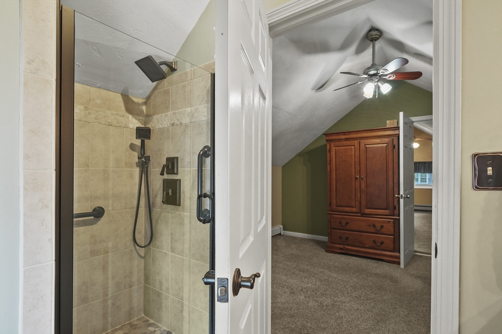 8 Beach Road Shrewsbury, MA 01545 - Photo 22 of 40 a bathroom with a shower and a mirror