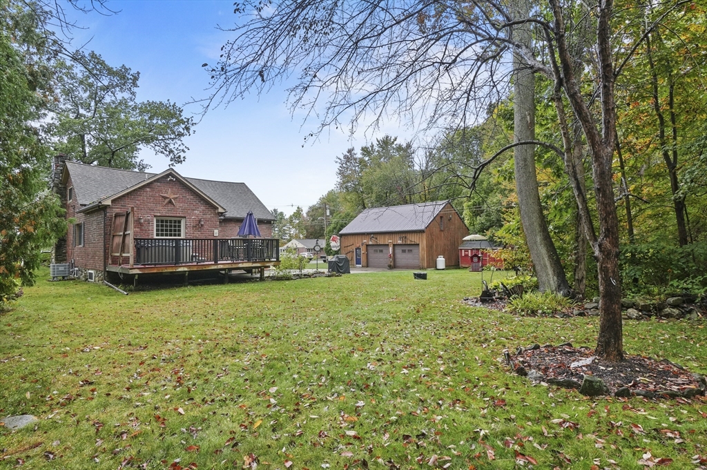 8 Beach Road Shrewsbury, MA 01545 - Photo 32 of 40 a front view of a house with garden