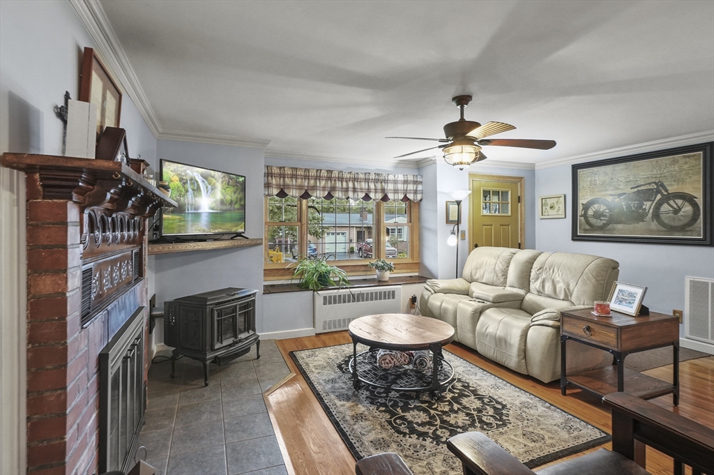 8 Beach Road Shrewsbury, MA 01545 - Photo 6 of 40 a living room with furniture a rug and a window