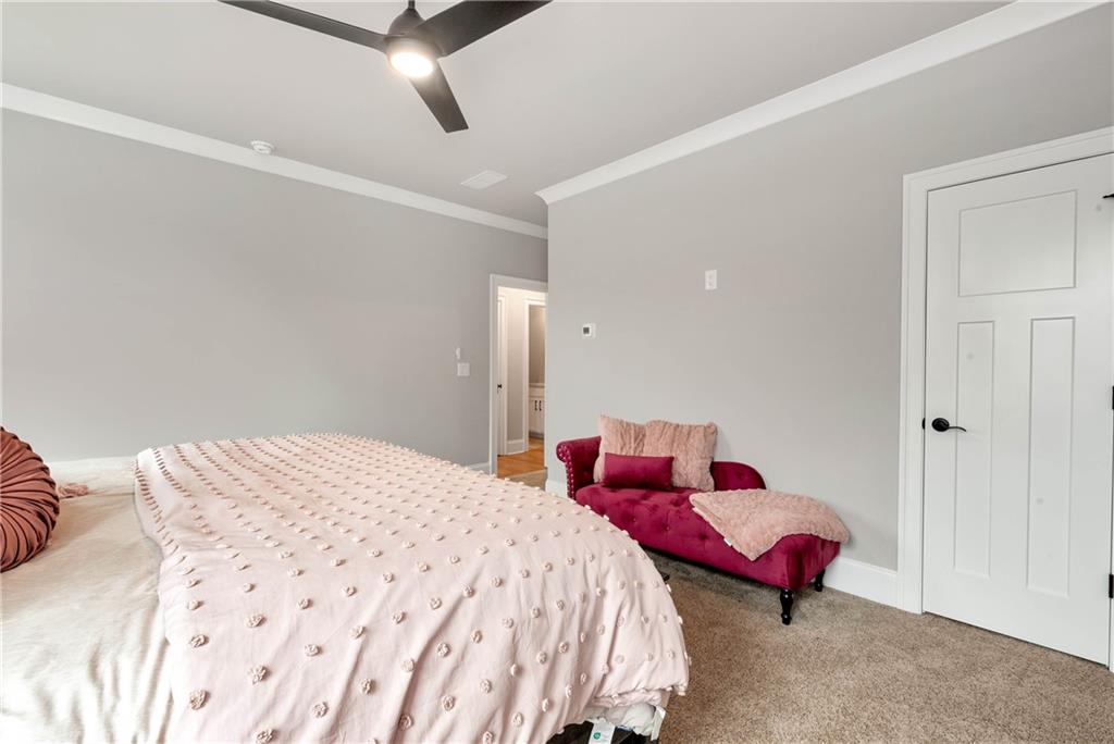 6140 Crescent Moon Ridge Cumming, GA 30041 - Photo 45 of 54 a bedroom with a bed and window