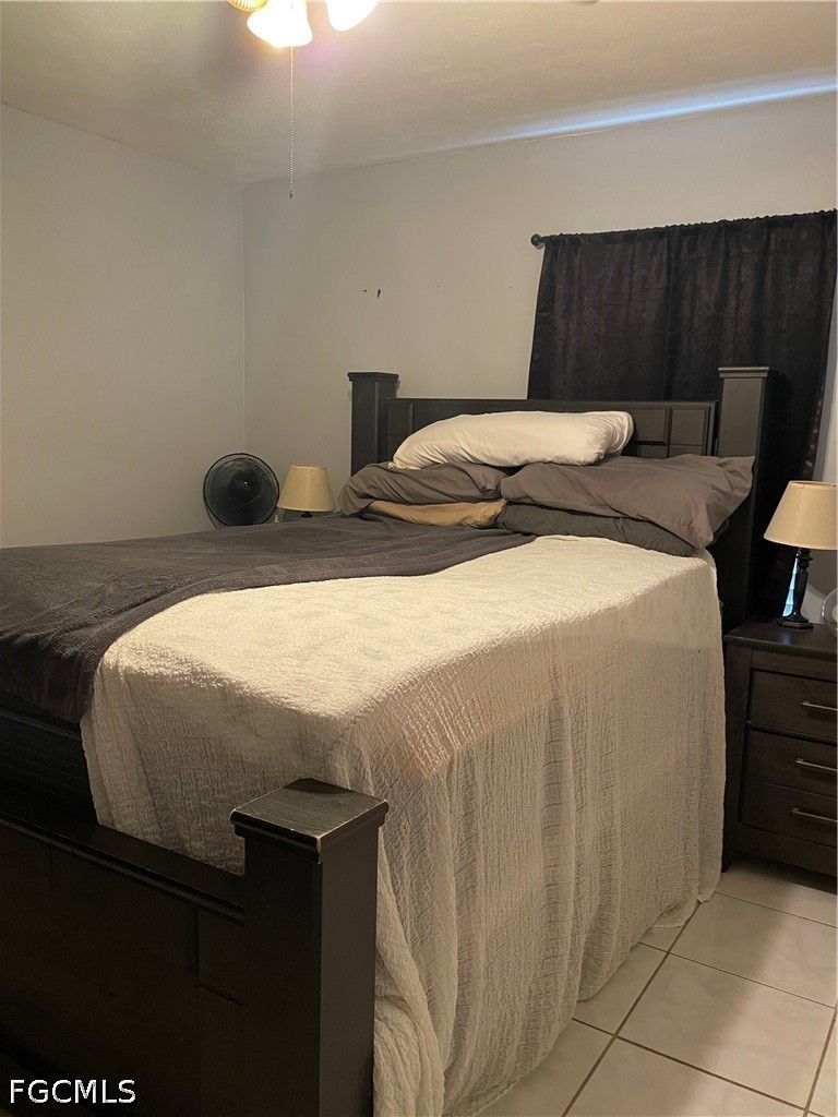 2239 Lotus Road Fort Myers, FL 33905 - Photo 11 of 26 a bedroom with a bed and a dresser