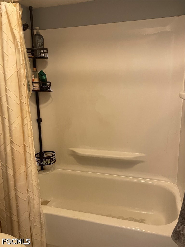 2239 Lotus Road Fort Myers, FL 33905 - Photo 17 of 26 a bathroom with a bathtub
