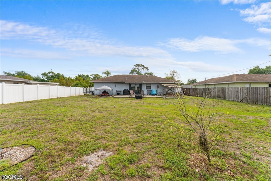 2239 Lotus Road Fort Myers, FL 33905 - Photo 24 of 26 a view of a big yard with table and chair