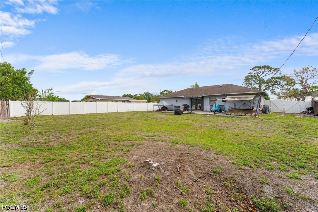 2239 Lotus Road Fort Myers, FL 33905 - Photo 25 of 26 a house view with a garden space