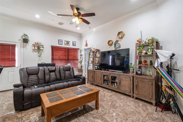 a living room with furniture and a flat screen tv