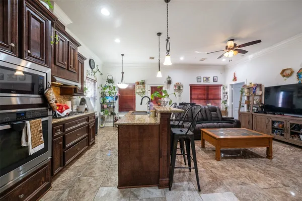 a living room with lots of furniture and a flat screen tv