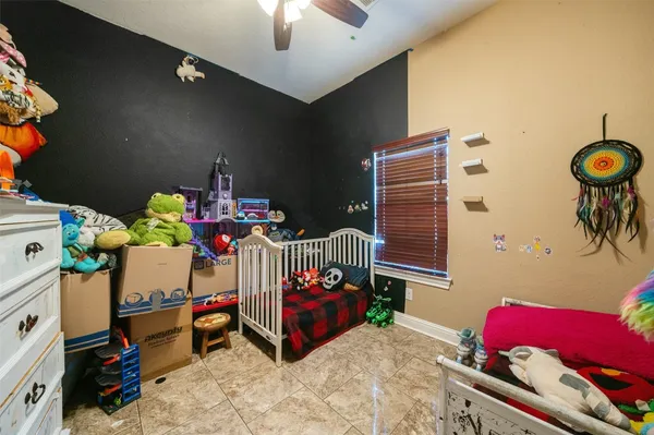 a bedroom with furniture and a chair