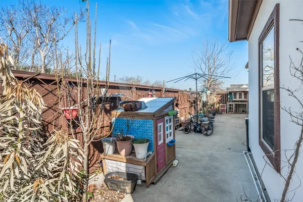 a view of living room filled with furniture and chandelier
