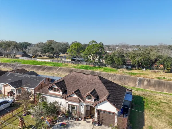 a view of a swimming pool and a yard