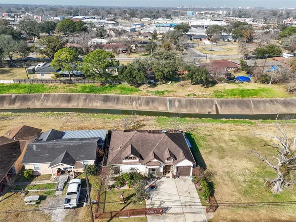 an aerial view of a house with a lake view