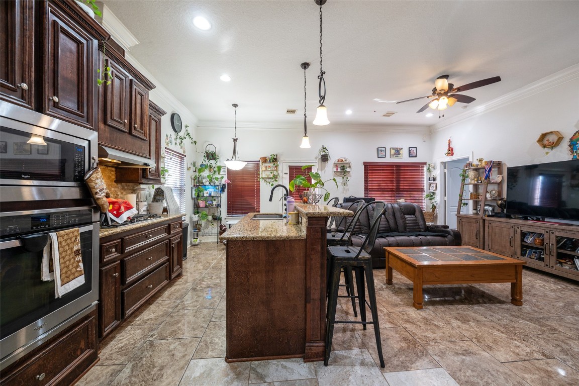 1508 Miami Road Pasadena, TX 77502 - Photo 6 of 17 a living room with lots of furniture and a flat screen tv