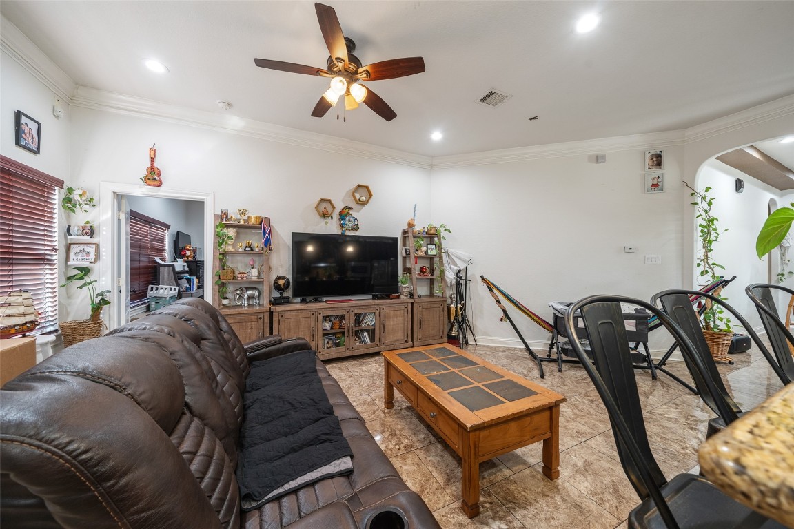 1508 Miami Road Pasadena, TX 77502 - Photo 8 of 34 a living room with furniture a flat screen tv and a window