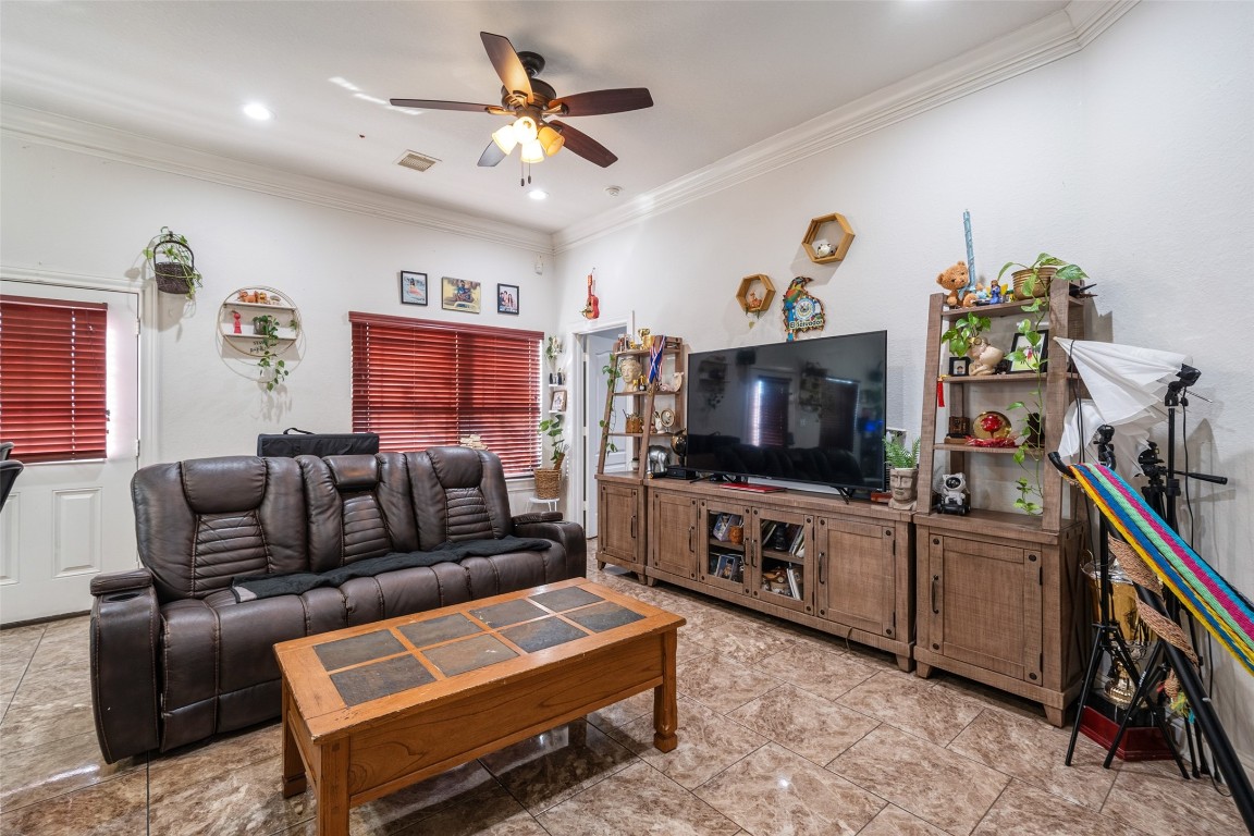 1508 Miami Road Pasadena, TX 77502 - Photo 8 of 17 a living room with furniture and a flat screen tv