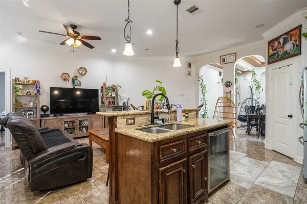 a view of living room with furniture and a flat screen tv