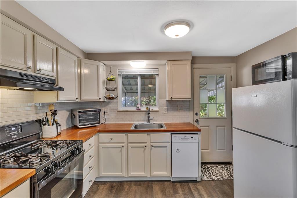3779 Northern Pike Monroeville, PA 15146 - Photo 13 of 31 a kitchen with stainless steel appliances a refrigerator a sink a stove and cabinets