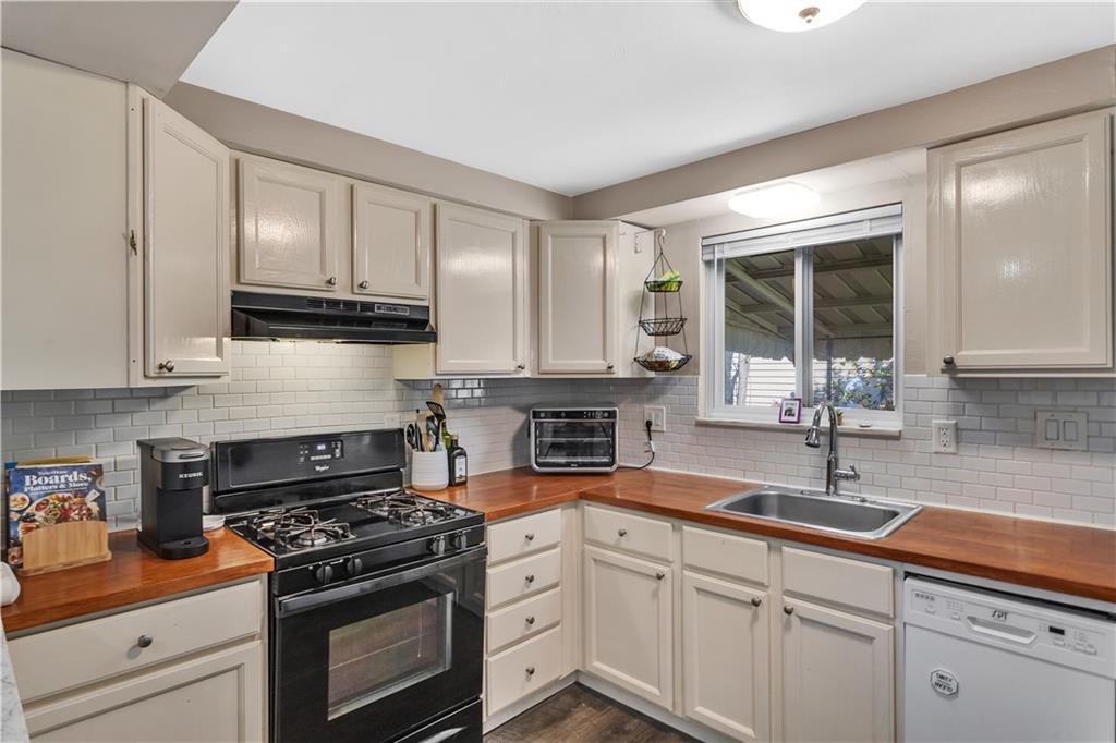 3779 Northern Pike Monroeville, PA 15146 - Photo 14 of 31 a kitchen with stainless steel appliances granite countertop a sink stove and cabinets