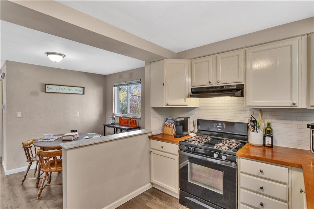 3779 Northern Pike Monroeville, PA 15146 - Photo 15 of 31 a kitchen with stainless steel appliances a white stove top oven and cabinets