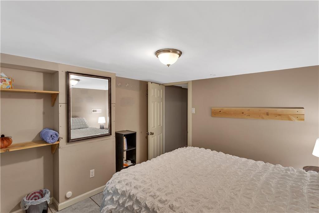 3779 Northern Pike Monroeville, PA 15146 - Photo 27 of 31 a bedroom with a bed and a mirror