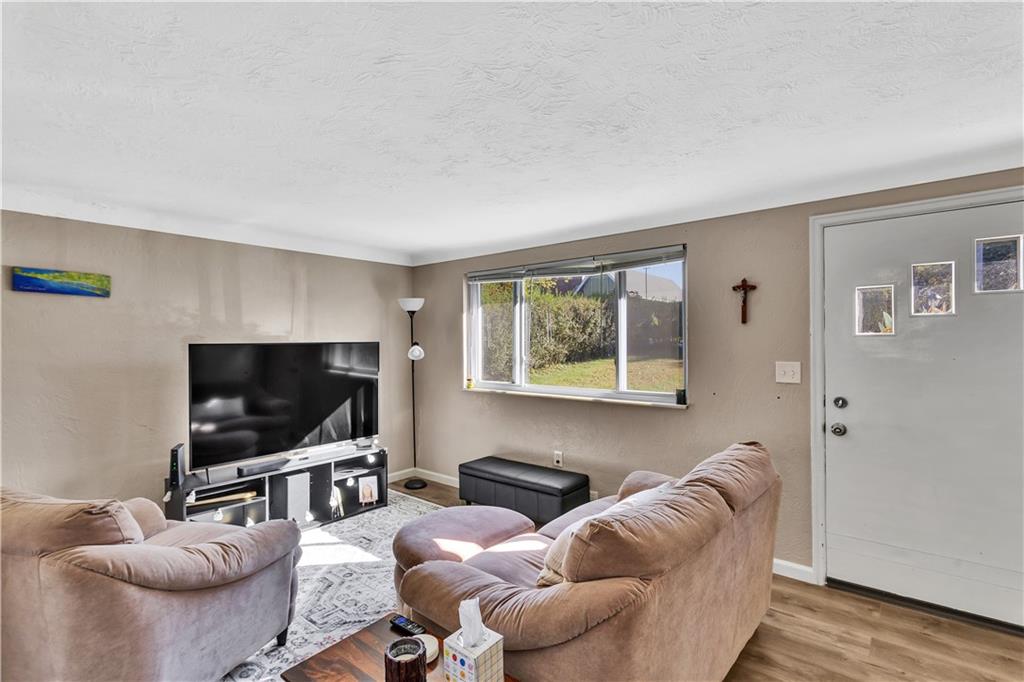 3779 Northern Pike Monroeville, PA 15146 - Photo 5 of 31 a living room with furniture and a flat screen tv