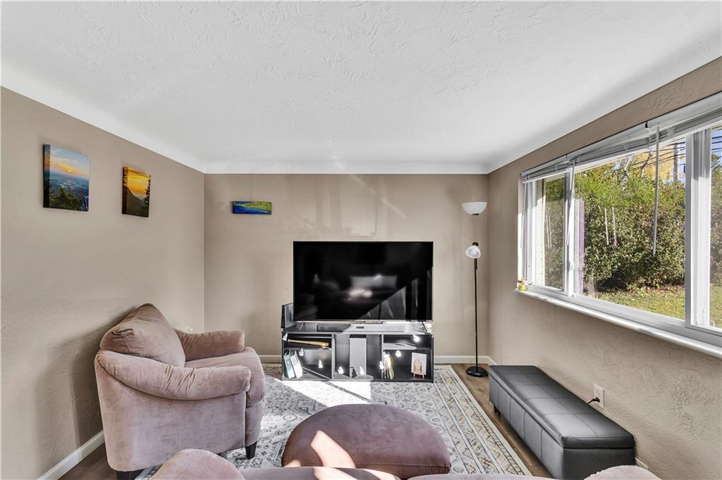 3779 Northern Pike Monroeville, PA 15146 - Photo 8 of 31 a living room with furniture and a flat screen tv