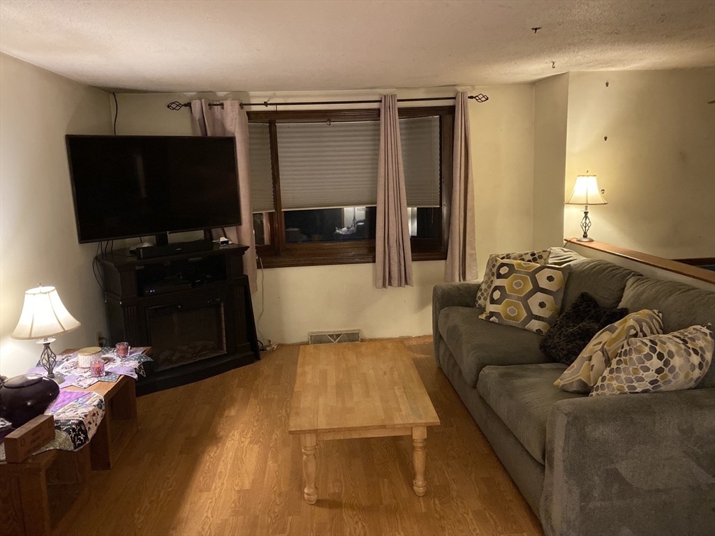 147 Barker Road East Wareham, MA 02538 - Photo 4 of 14 a living room with a couch and a flat screen tv