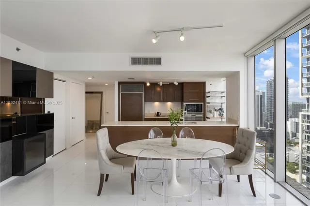 a dining room with furniture and window