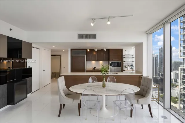 a dining room with furniture and window