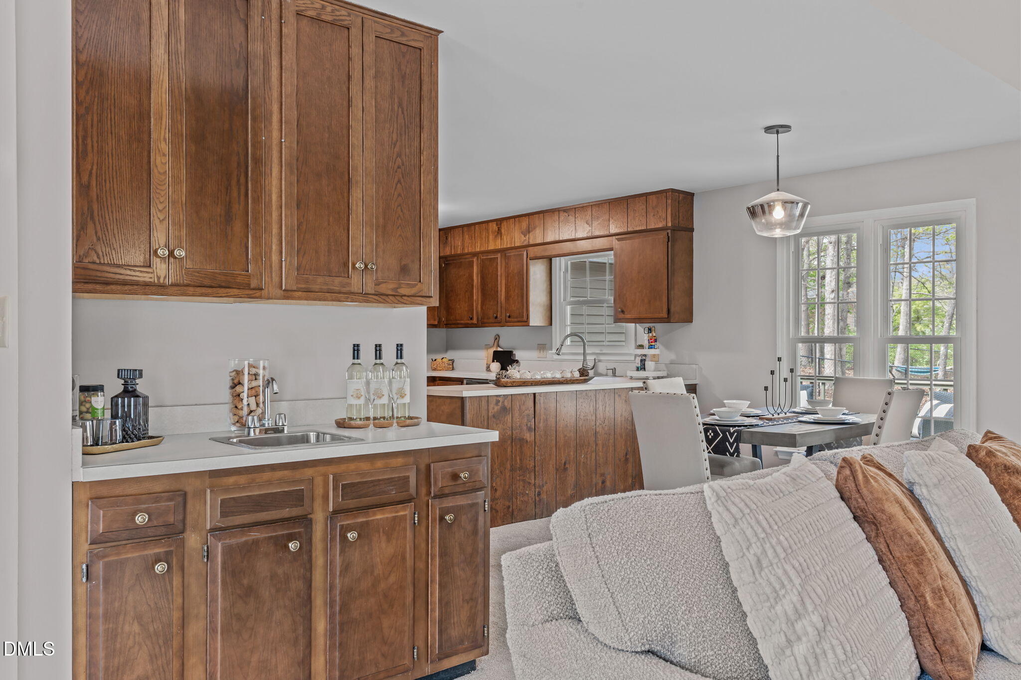 3304 Wade Avenue Raleigh, NC 27607 - Photo 6 of 38 a kitchen with stainless steel appliances kitchen island granite countertop a sink dishwasher stove and cabinets