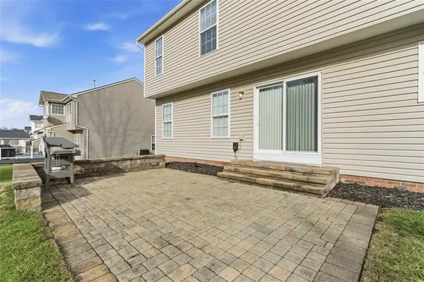 a view of a house with a backyard