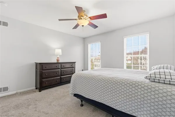 a bedroom with a bed and window