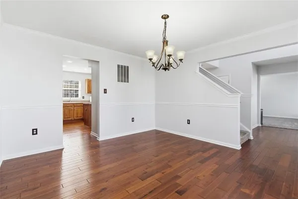 a view of a livingroom with wooden floor