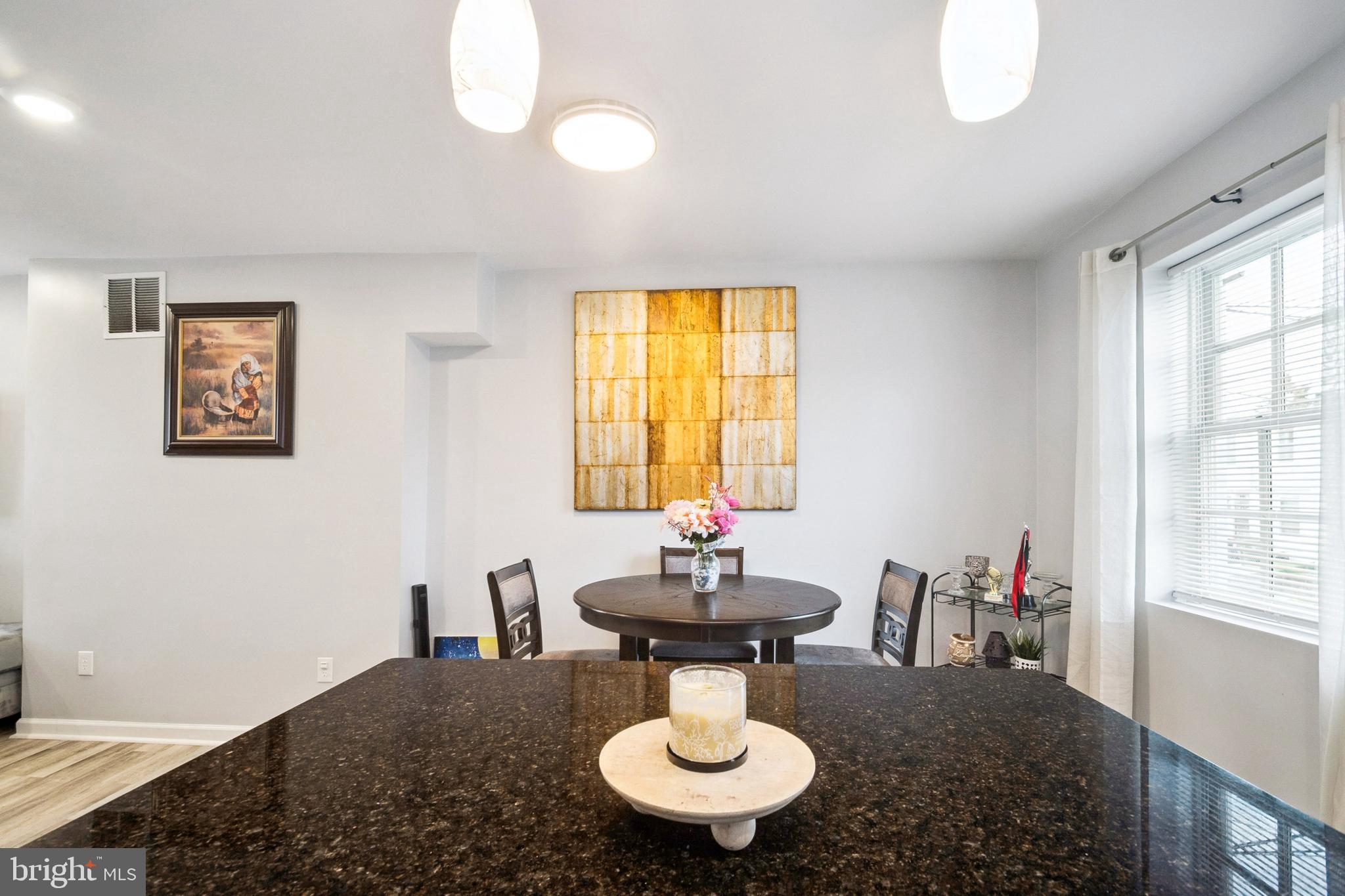 3404 Lyndale Avenue Baltimore, MD 21213 - Photo 13 of 25 a view of a livingroom with furniture and window