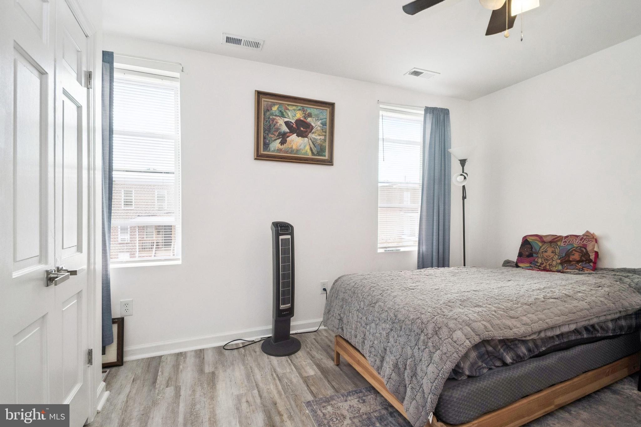 3404 Lyndale Avenue Baltimore, MD 21213 - Photo 16 of 25 a bedroom with a bed and a window