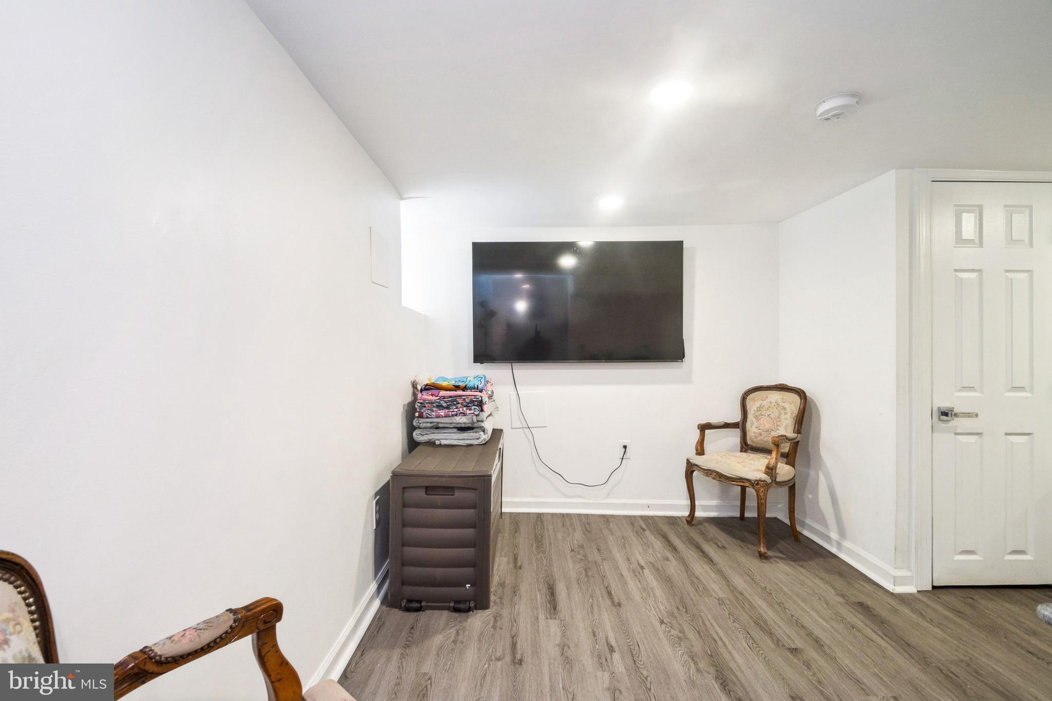 3404 Lyndale Avenue Baltimore, MD 21213 - Photo 19 of 25 a living room with furniture and a flat screen tv