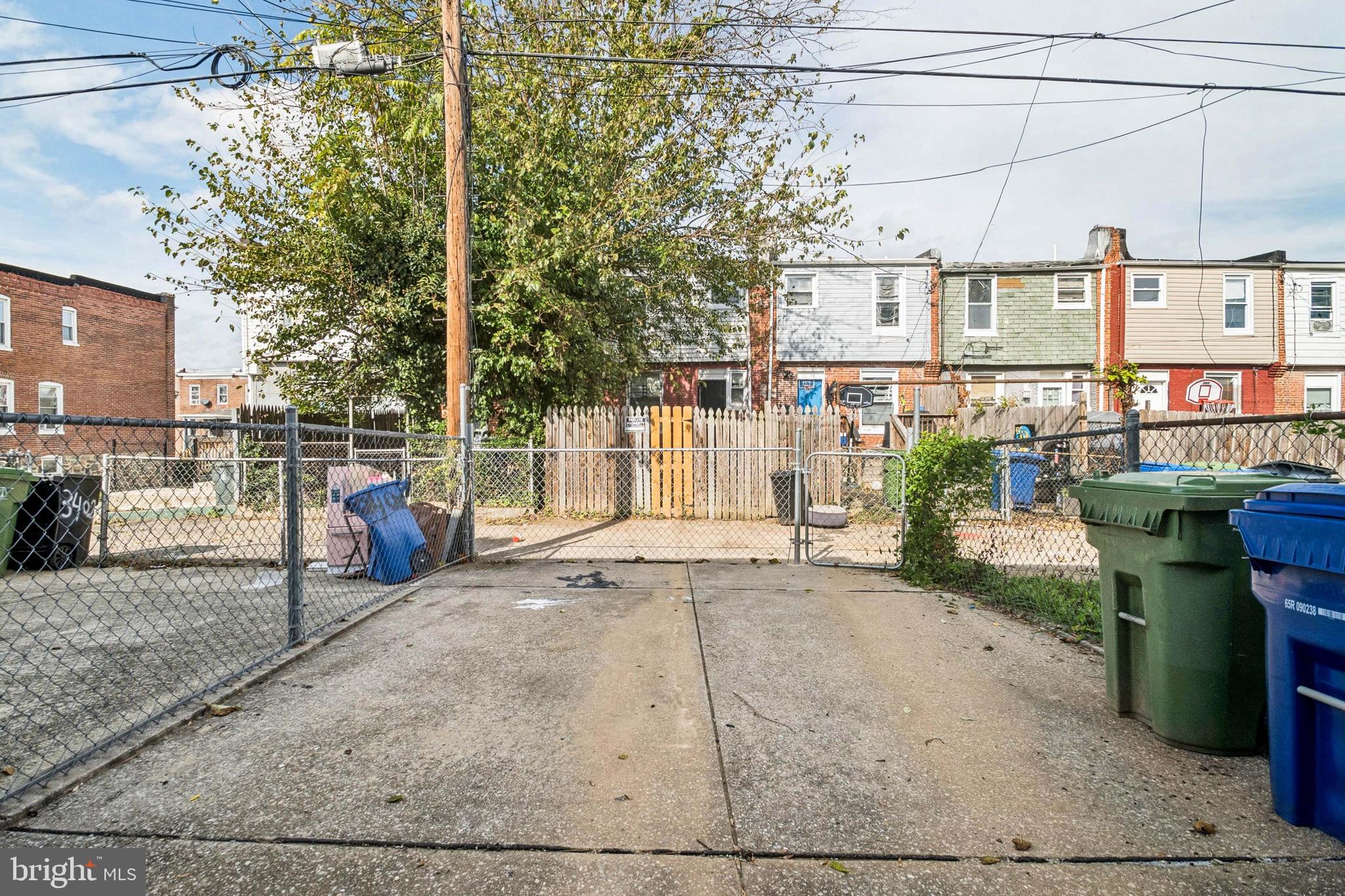 3404 Lyndale Avenue Baltimore, MD 21213 - Photo 25 of 25 a view of a backyard with wooden fence