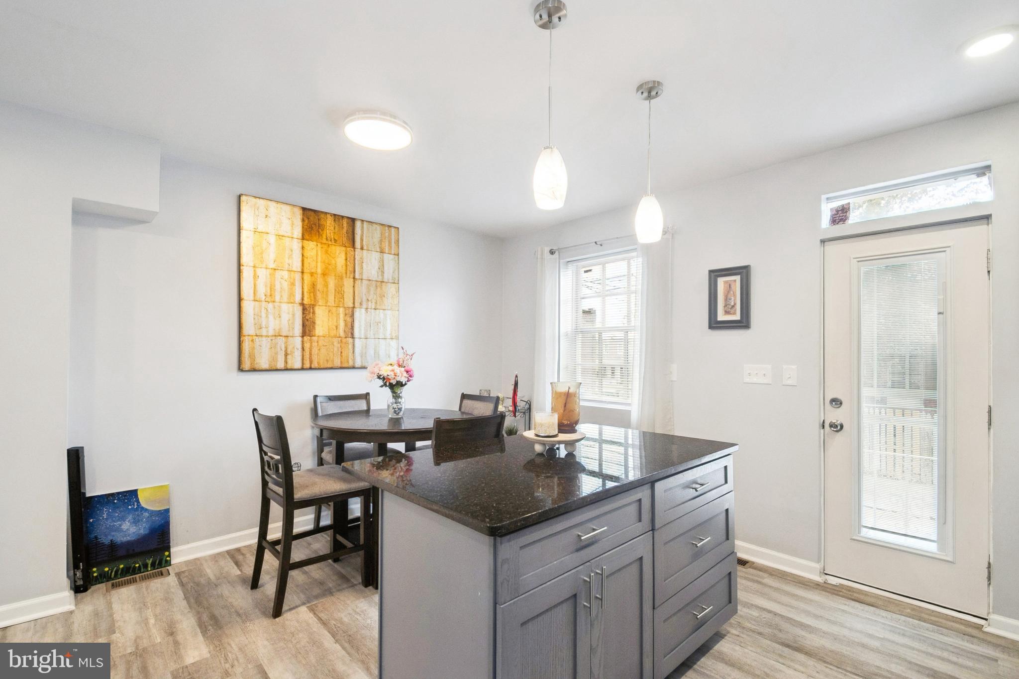 3404 Lyndale Avenue Baltimore, MD 21213 - Photo 6 of 25 a kitchen with a stove a sink and a refrigerator