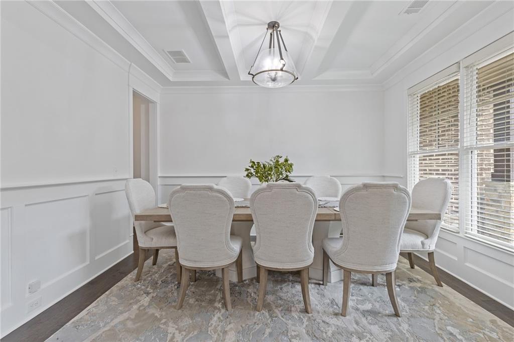4867 Hunters Grove Way Sugar Hill, GA 30518 - Photo 11 of 61 a view of a dining room with furniture window and outside view