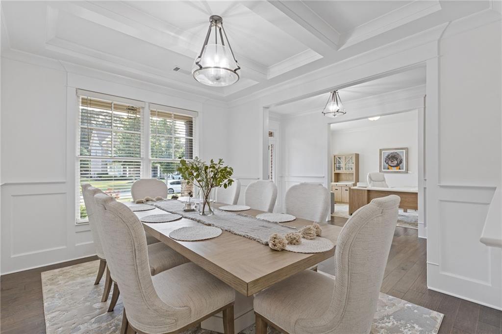 4867 Hunters Grove Way Sugar Hill, GA 30518 - Photo 12 of 61 a view of a dining room with furniture window and outside view