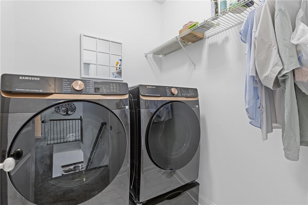 4867 Hunters Grove Way Sugar Hill, GA 30518 - Photo 29 of 61 a utility room with dryer and washer