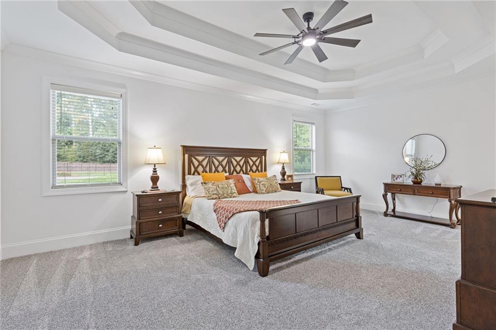 4867 Hunters Grove Way Sugar Hill, GA 30518 - Photo 30 of 61 a bed room with a bed and window