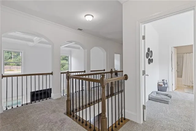 a bathroom with a sink vanity mirror and toilet