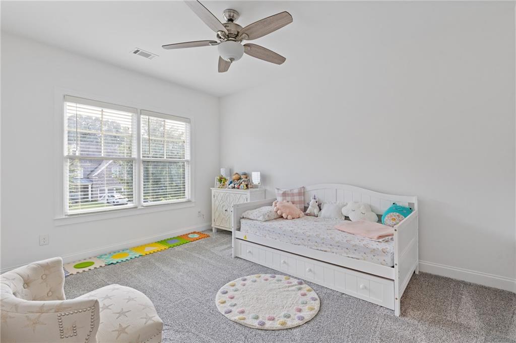 4867 Hunters Grove Way Sugar Hill, GA 30518 - Photo 45 of 61 a living room with furniture and a window