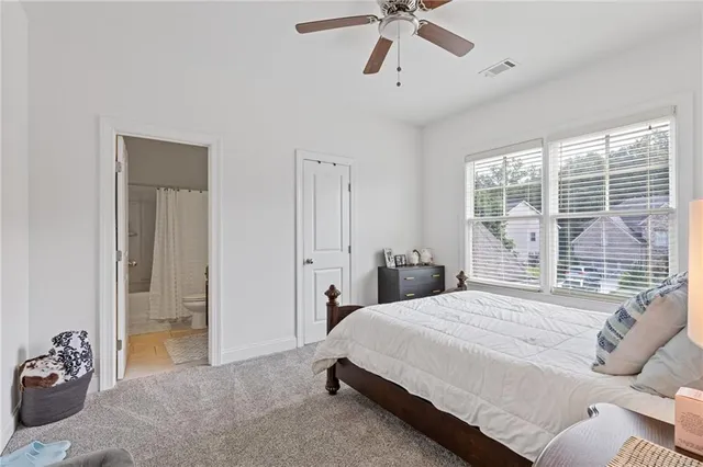 an aerial view of a house with swimming pool and garden